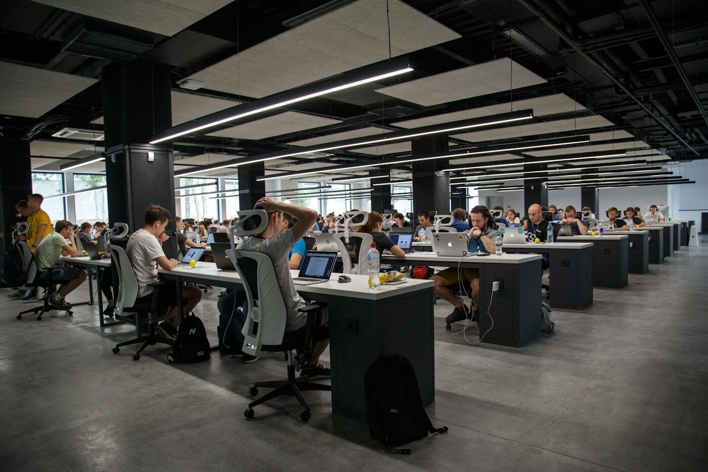 Engineers building software together in a modern workplace